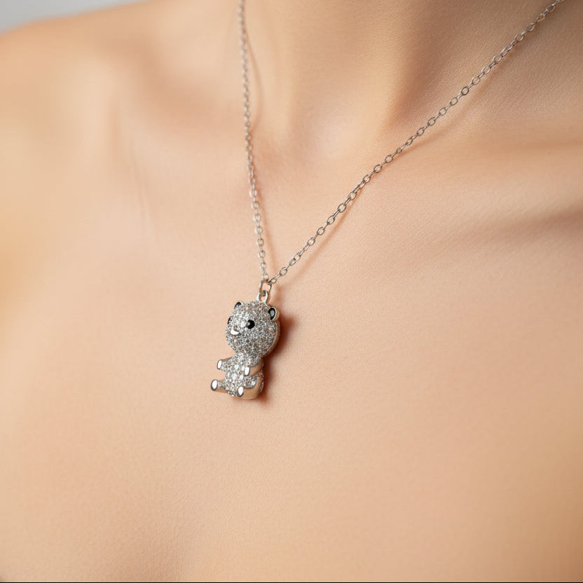 Silver panda pendant necklace on a white background